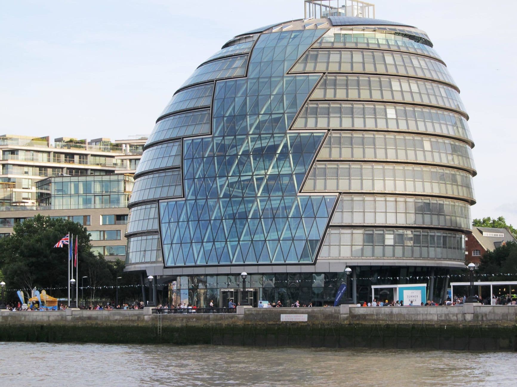 Stunning view of London's City Hall with its modern architectural design by the Thames River.